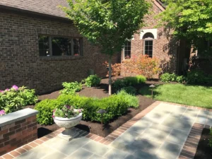 residential landscaping completed project with ornamental plants and trees